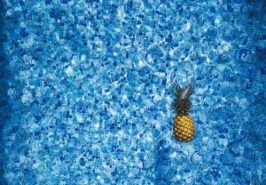 a pineapple in a swimming pool