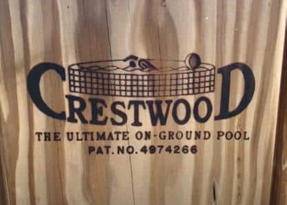 Crestwood logo stamped on wooden plank